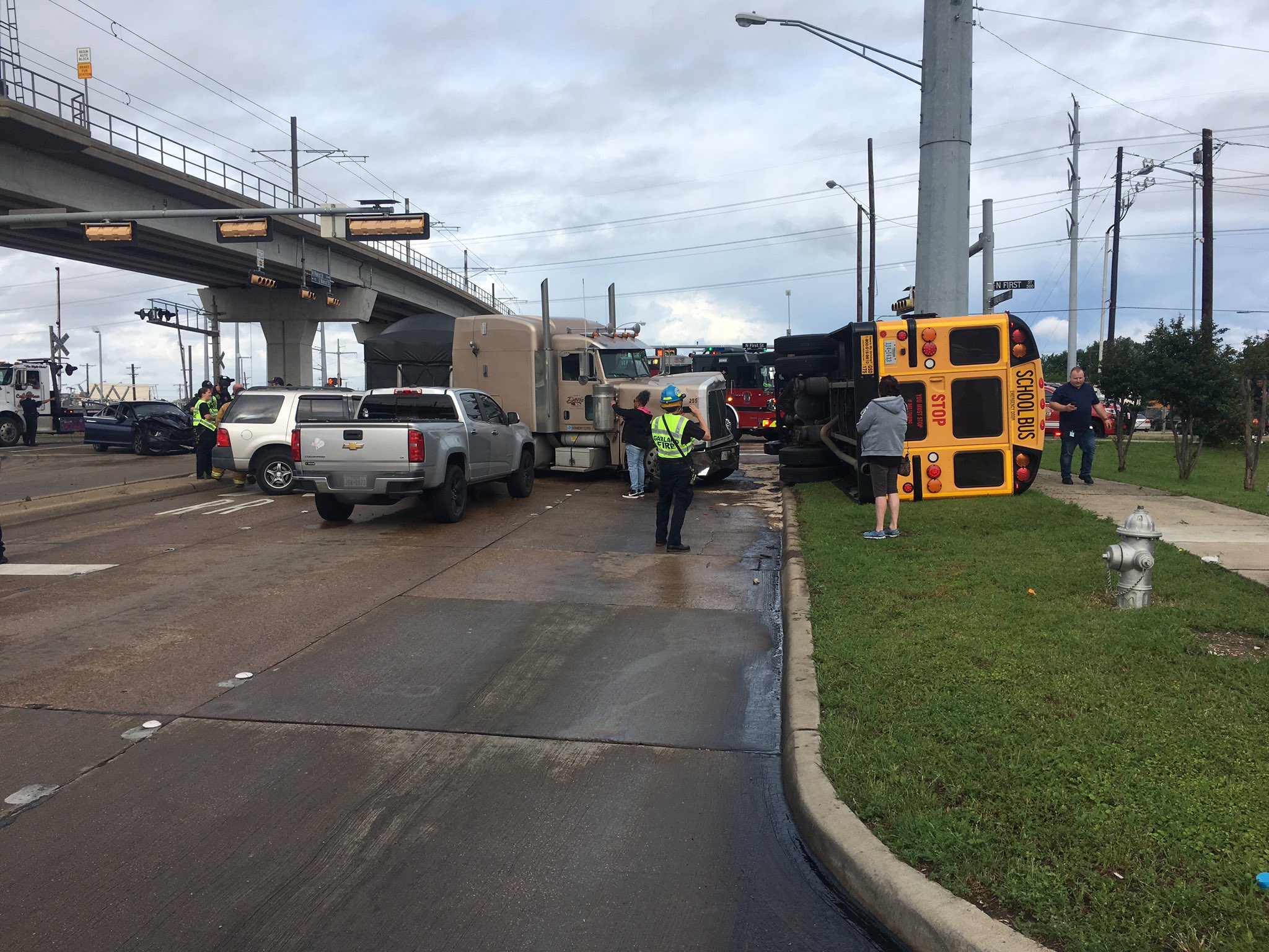 Garland police working multivehicle crash involving overturned school